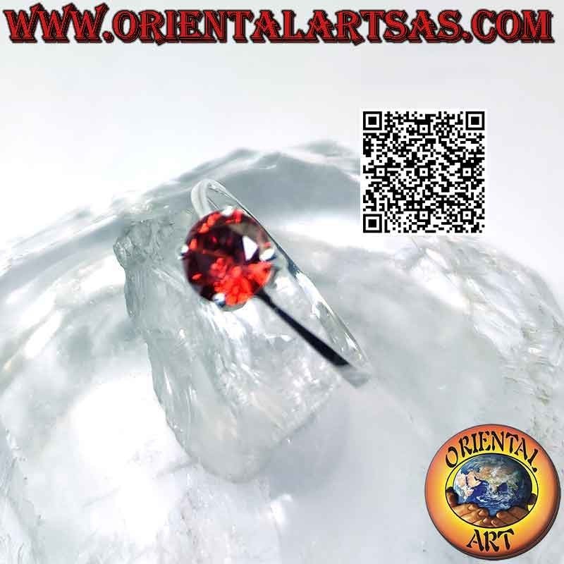 Silver ring with round garnet set on a smooth setting