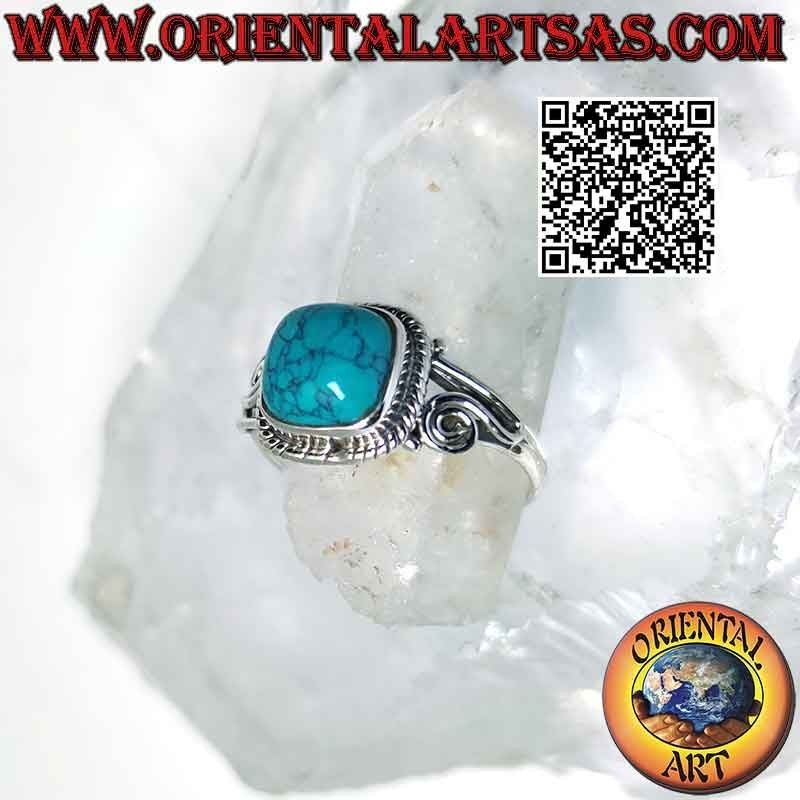 Silver ring with cabochon turquoise and asymmetrical spiral on the sides