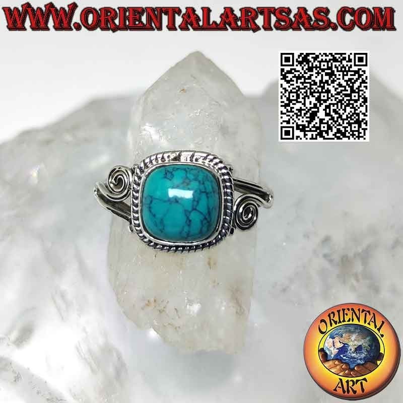 Silver ring with cabochon turquoise and asymmetrical spiral on the sides