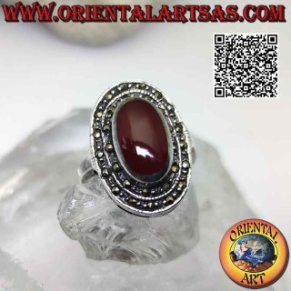 Silver ring with raised oval carnelian surrounded by two rows of marcasite