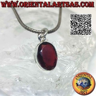 Silver pendant with oval garnet on a smooth high setting