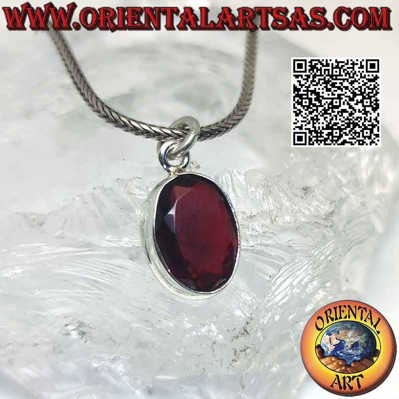 Silver pendant with oval garnet on a smooth high setting