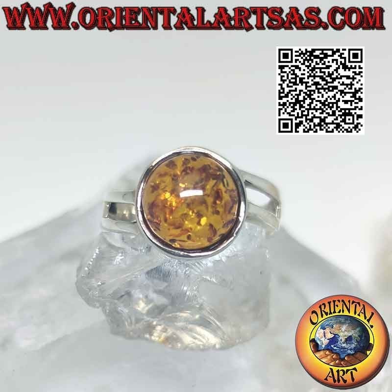 Anillo de plata con ámbar cabujón redondo y doble gancho asimétrico
