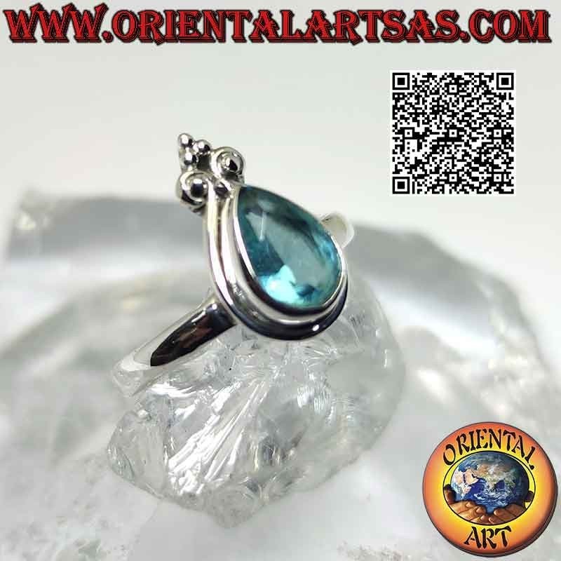 Anello in argento con topazio azzurro a goccia e giglio a corona