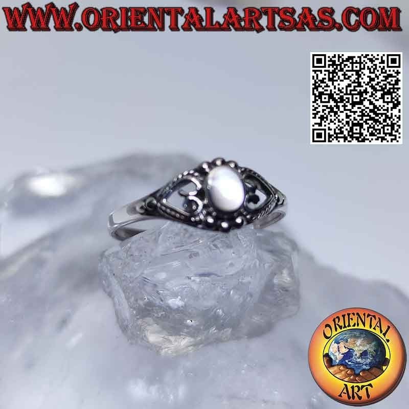 Silver ring with small oval mother of pearl between pierced heart