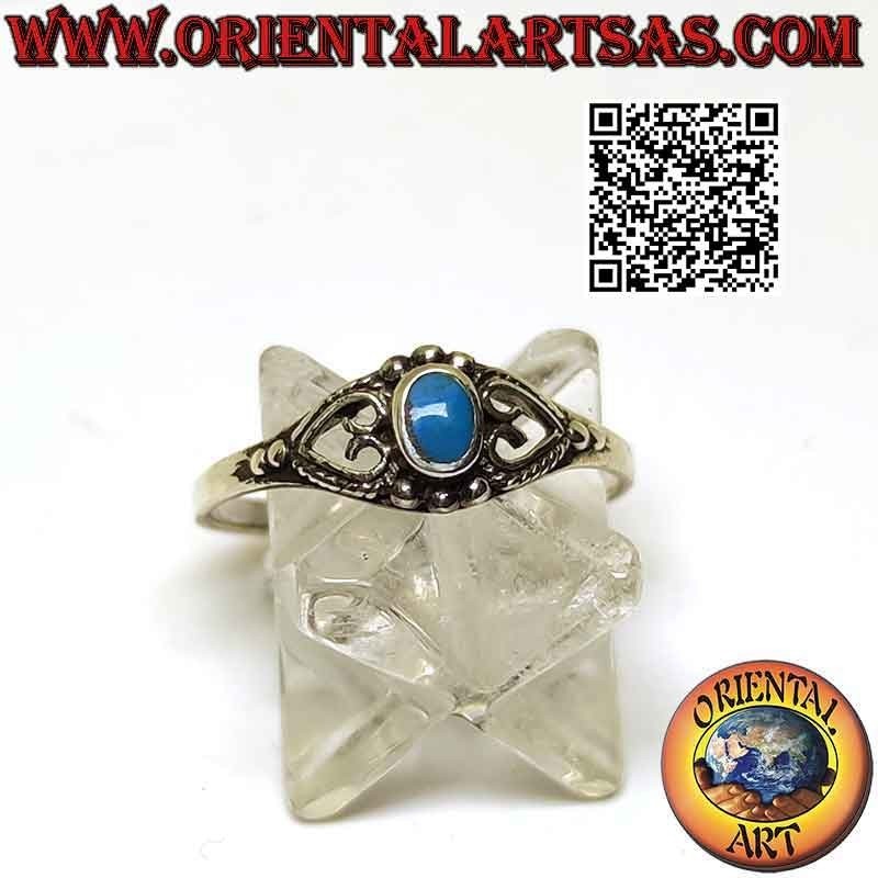 Silver ring with small oval turquoise between pierced heart