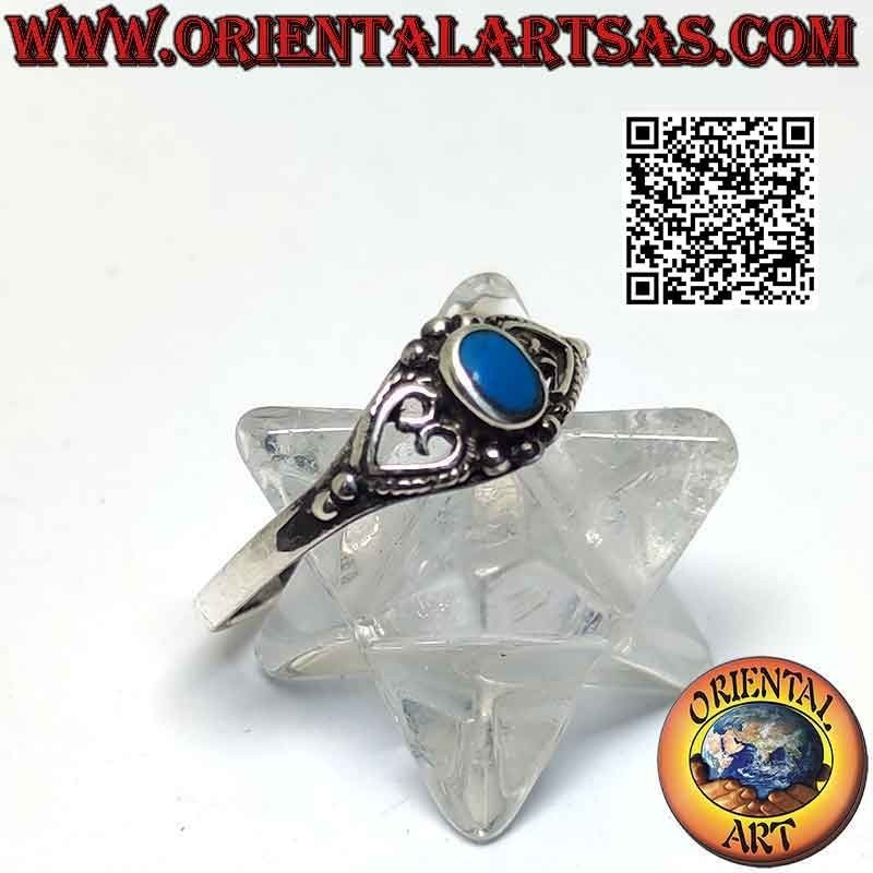 Silver ring with small oval turquoise between pierced heart