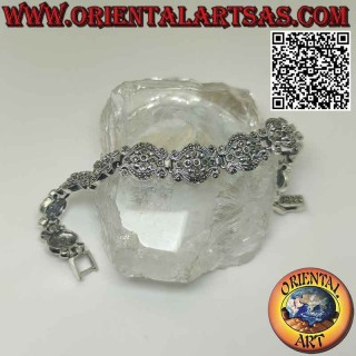 Bracelet in 925‰ silver with 10 pairs of waves with a central flower studded with marcasite