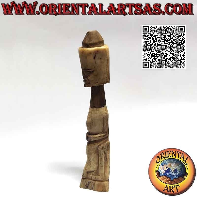 Primitive sculpture of a native with secret compartment in bone (25cm)