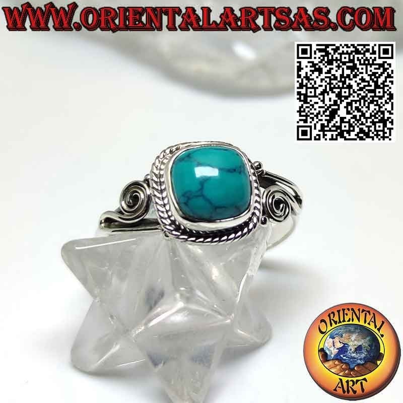 Silver ring with cabochon turquoise decorated with intertwining and spiral