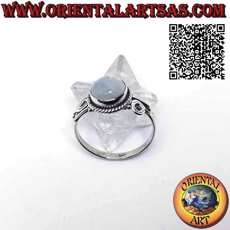 Silver ring with ornate round moonstone and spiral on the sides