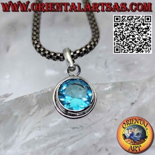 Silver pendant with faceted round blue topaz with simple edge