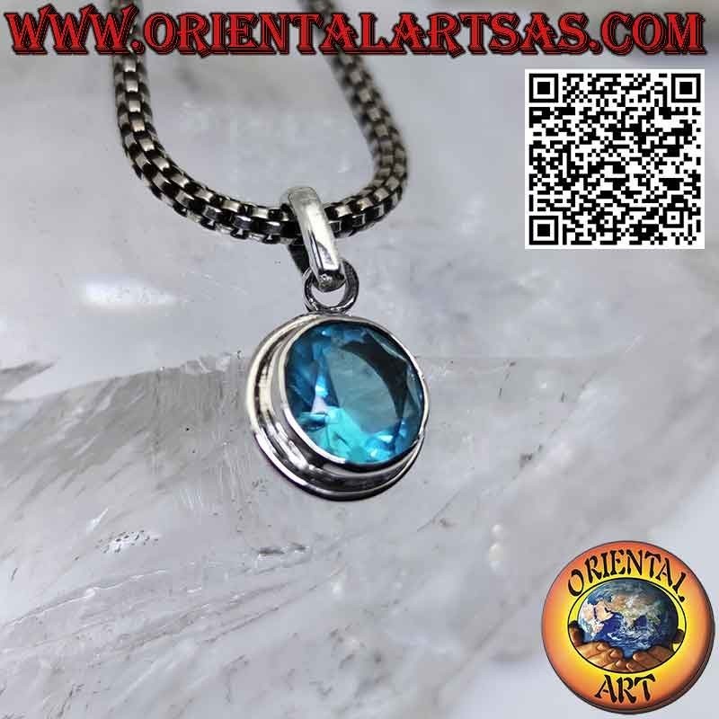 Silver pendant with faceted round blue topaz with simple edge