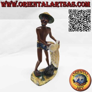 Beautiful and refined wooden sculpture of a fisherman with a net