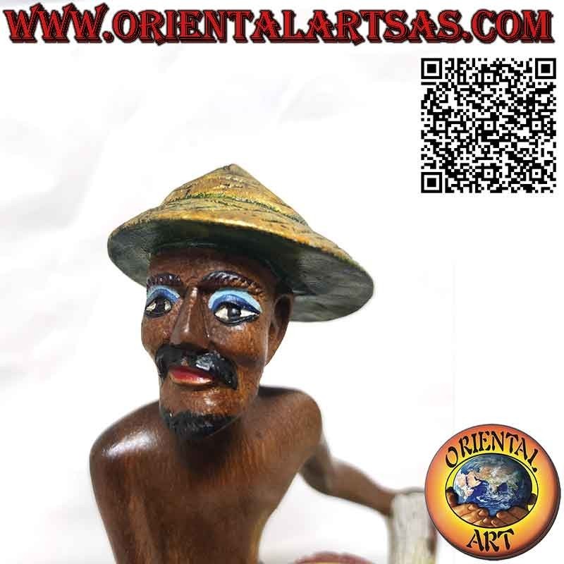 Beautiful and refined wooden sculpture of a fisherman with a net