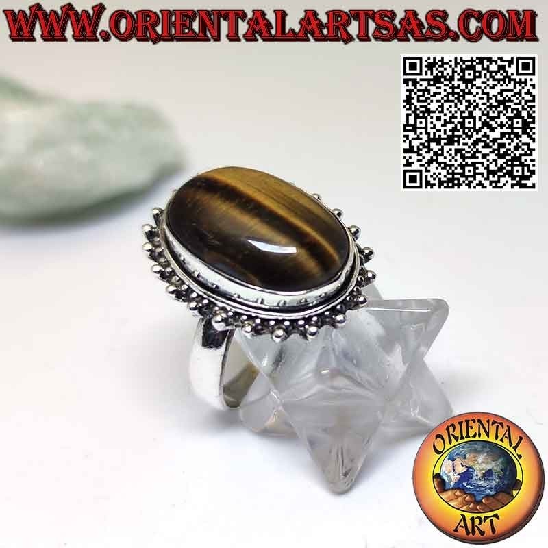 Anillo de flores de plata con gran ojo de tigre cabujón ovalado rodeado de puntos