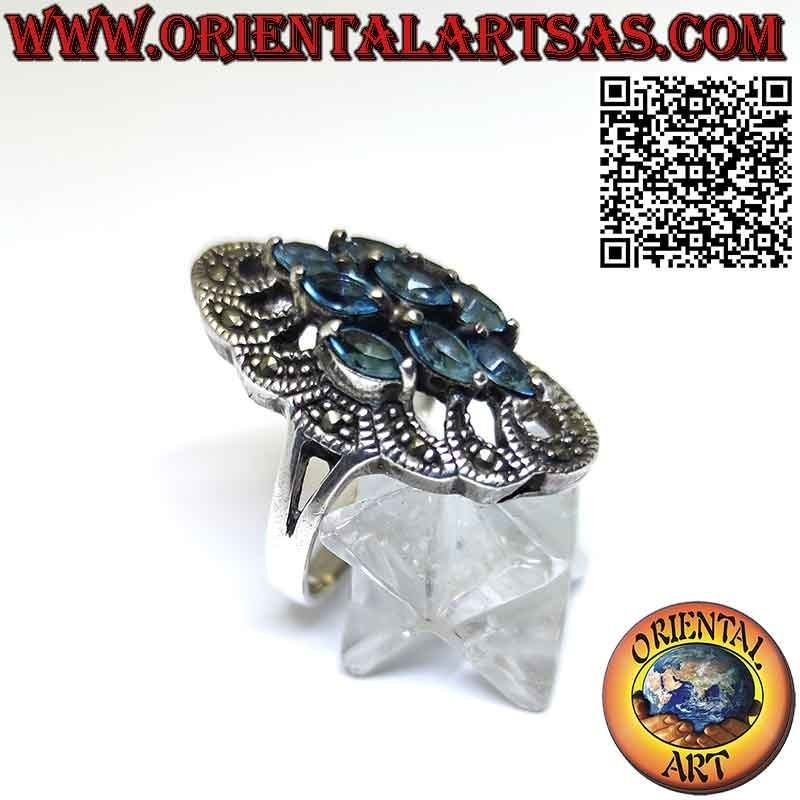 Anello in argento spoletta con 9 topazio azzurro a navetta e marcasite
