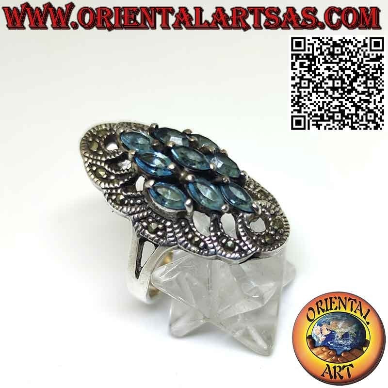 Anello in argento spoletta con 9 topazio azzurro a navetta e marcasite