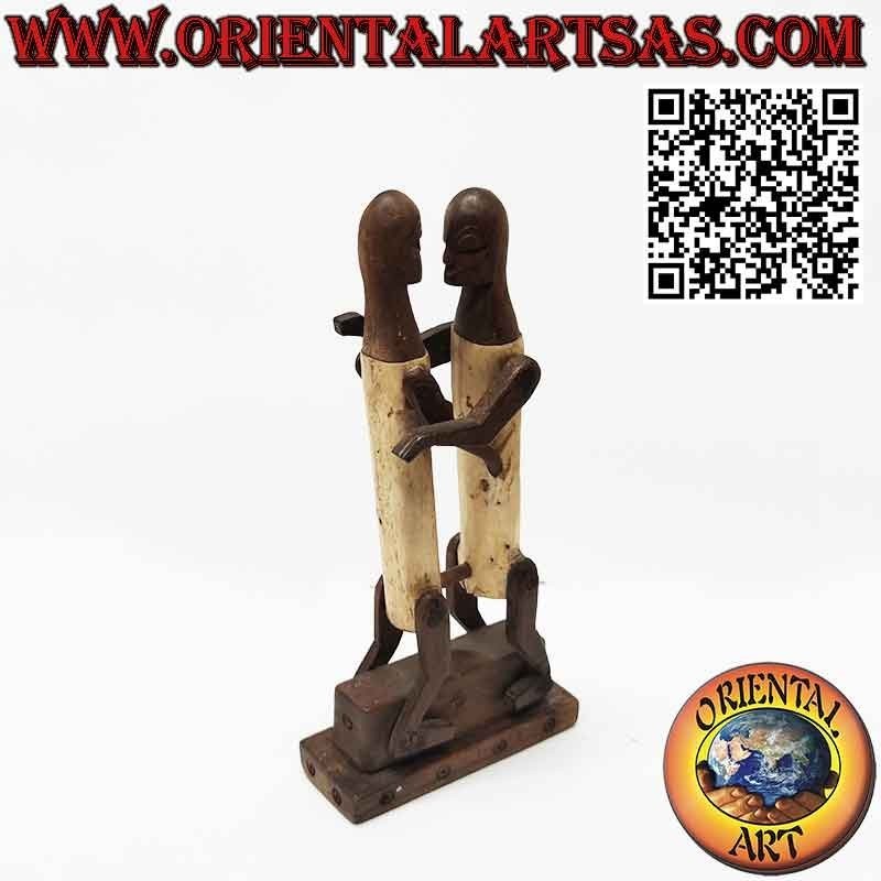 Sculpture couple in love Dayak Borneo in tribal primitive ebony bone