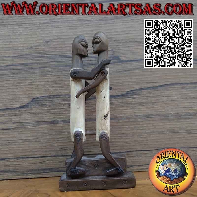 Sculpture couple in love Dayak Borneo in tribal primitive ebony bone