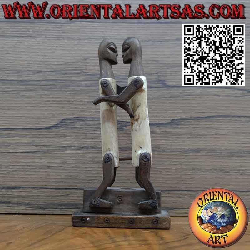 Sculpture couple in love Dayak Borneo in tribal primitive ebony bone