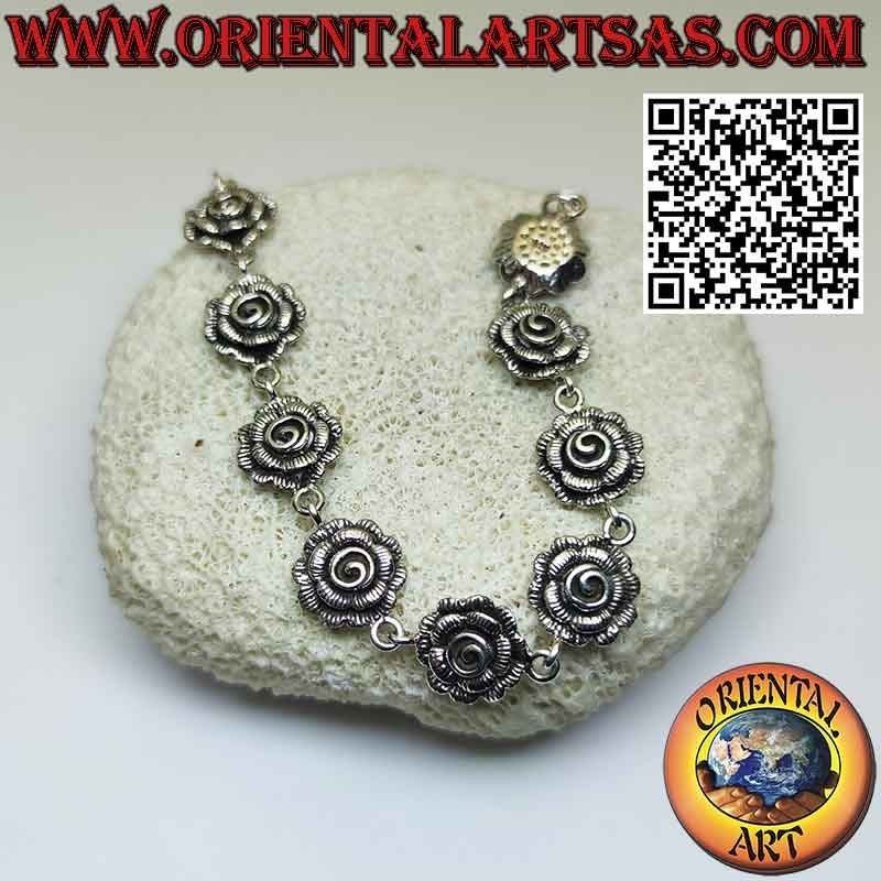 Bracelet en argent 925‰ composé de neuf belles grandes roses