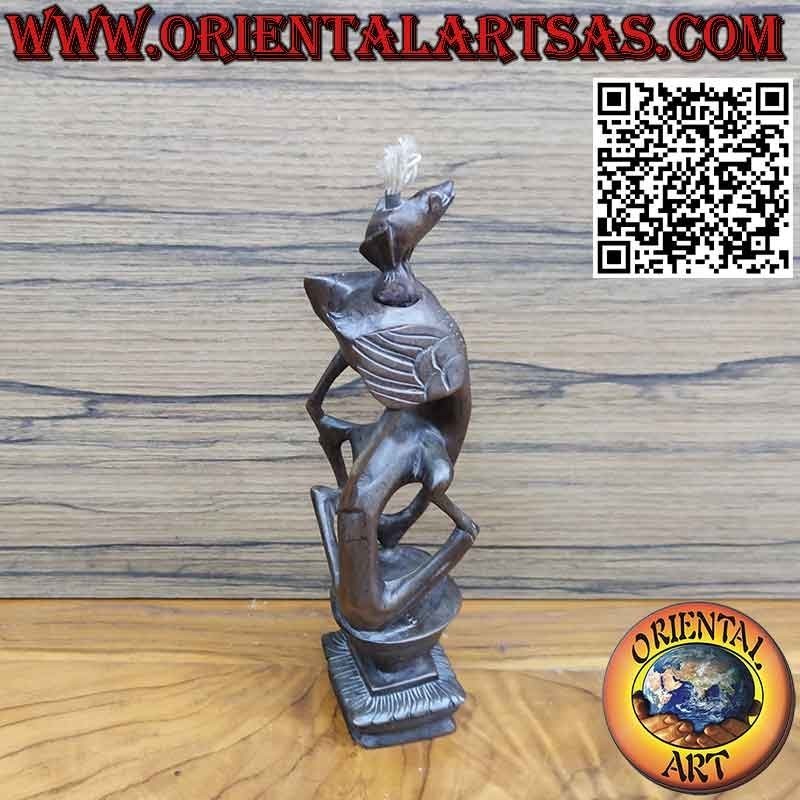 Rare ebony sculpture of a man, a pelican and an illuminated bat