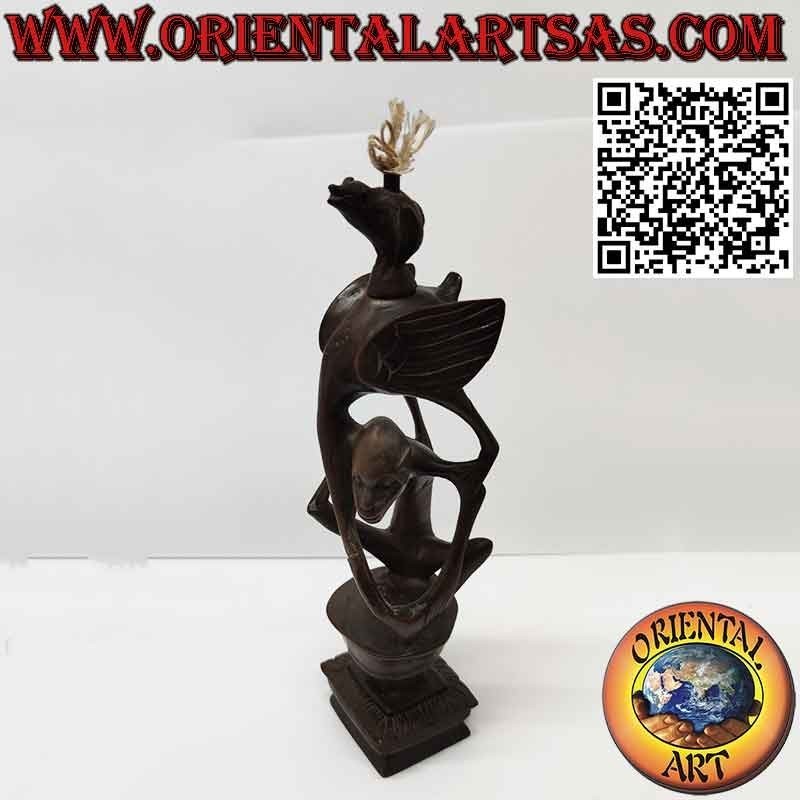 Rare ebony sculpture of a man, a pelican and an illuminated bat