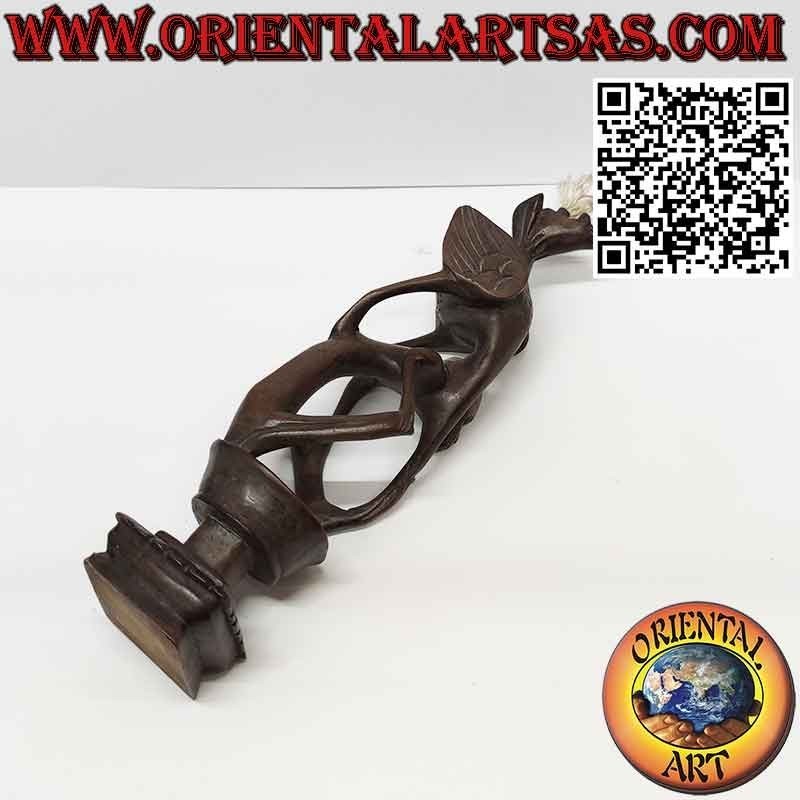 Rare ebony sculpture of a man, a pelican and an illuminated bat