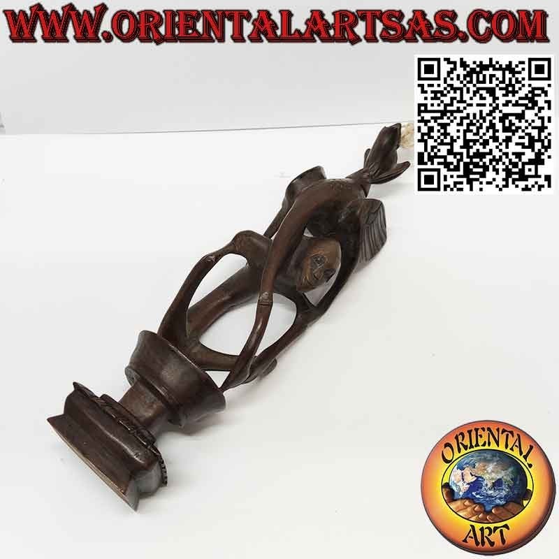 Rare ebony sculpture of a man, a pelican and an illuminated bat