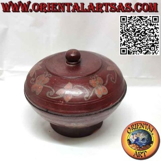 Ancient round container in mahogany wood and floral designs of the Dayaks