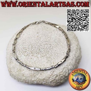 Silver bracelet with threaded cylinders and prism made by the Karen