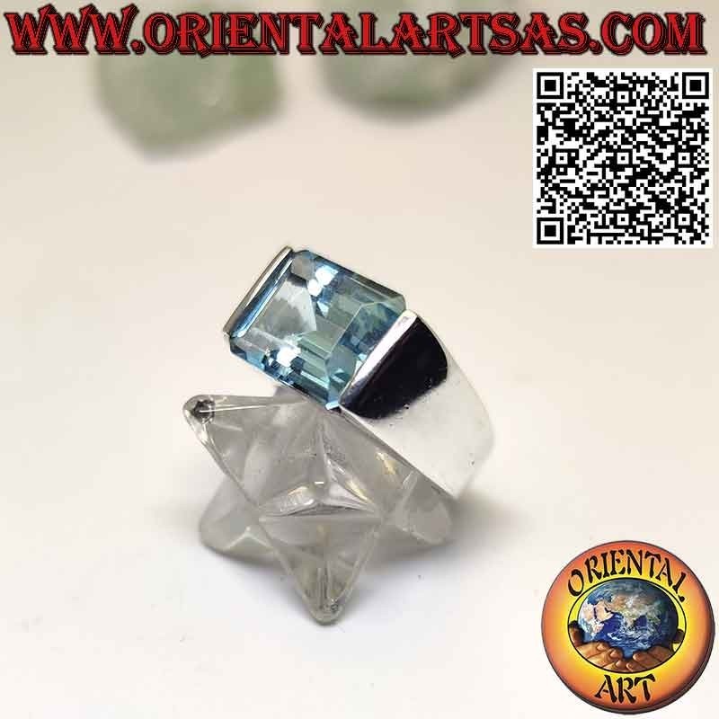 Silver ring with horizontally embedded rectangular blue topaz