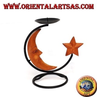 Iron candlestick with moon and star in wood