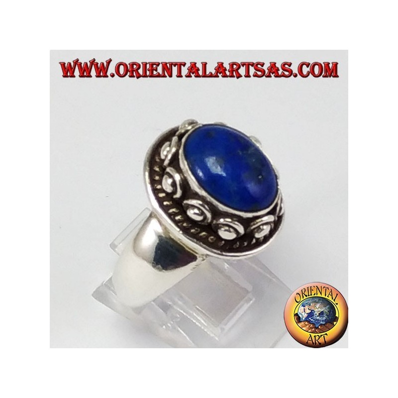 Silver ring with studSilver ring with studs around the box, with oval natural lapis lazuli