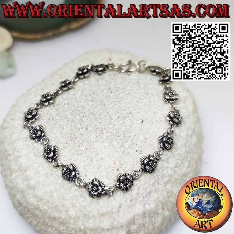 Bracciale con sedici rose in argento 925 ‰ in fila unite da un anello