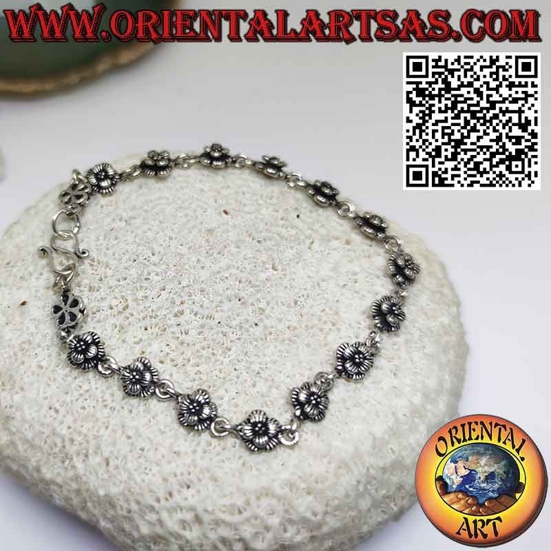 Bracelet with sixteen roses in 925 ‰ silver in rows joined by a ring