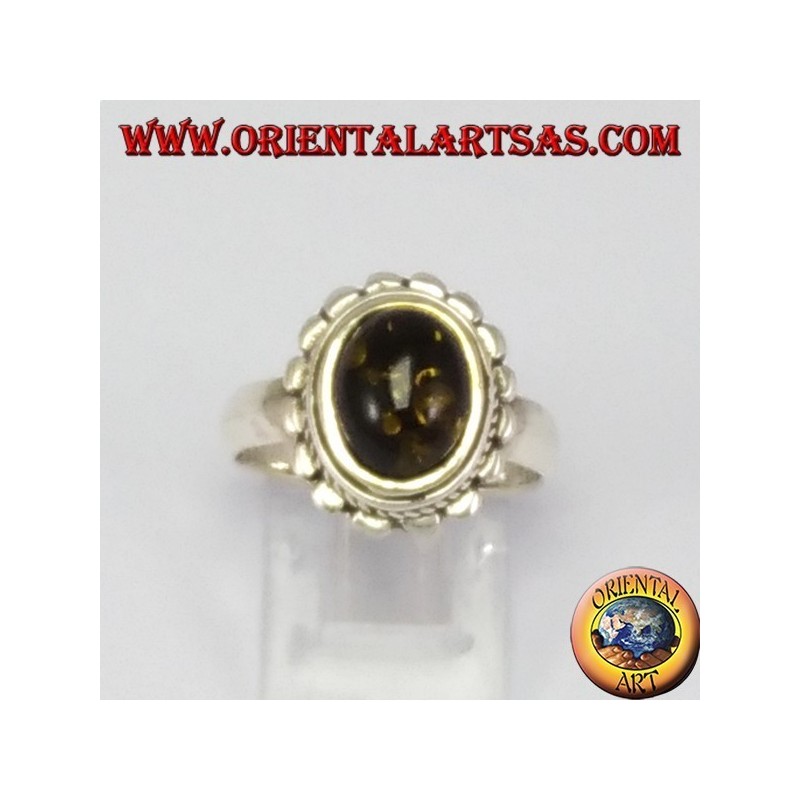 Silver ring with oval green amber