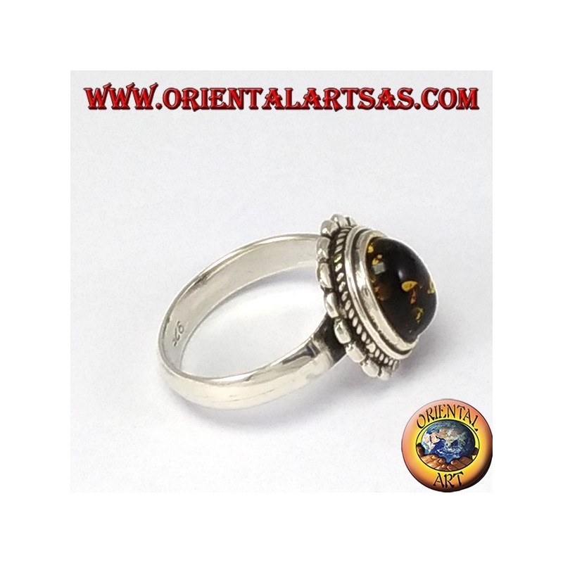 Silver ring with oval green amber