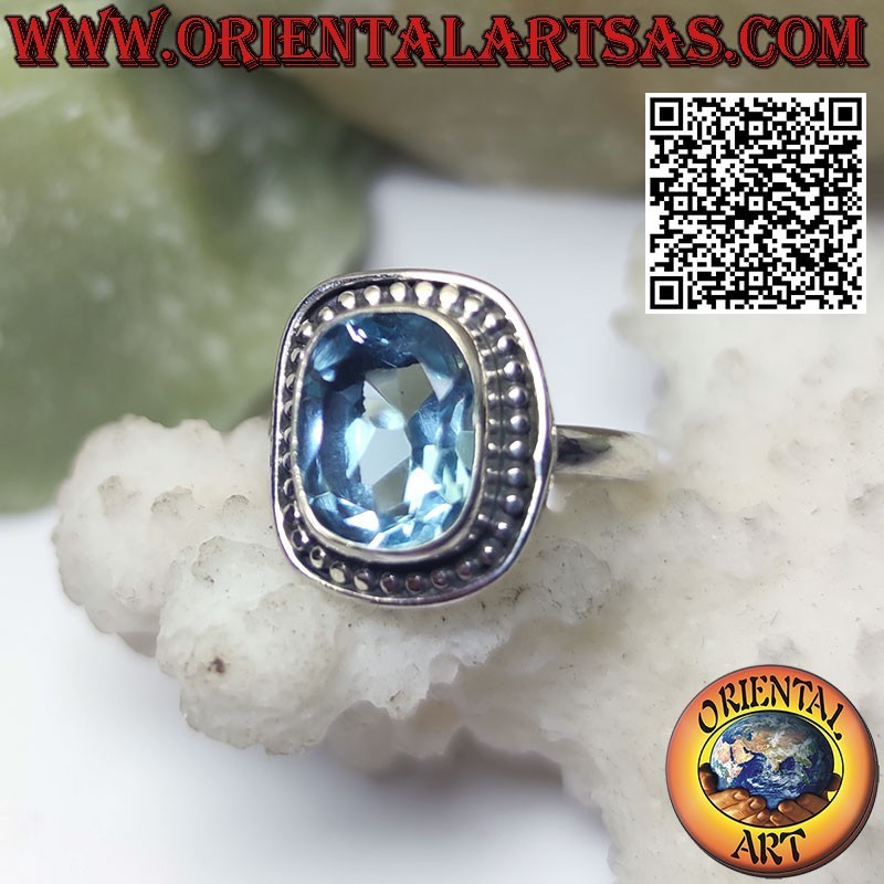 Silver ring with cushion-cut blue topaz set