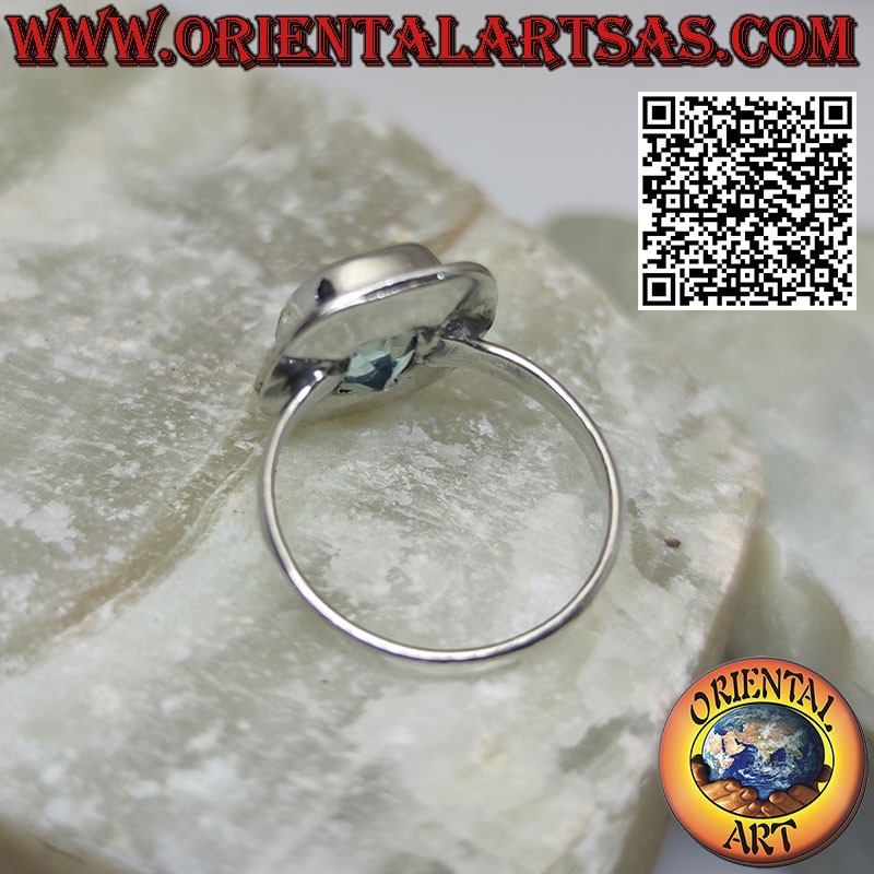 Silver ring with cushion-cut blue topaz set