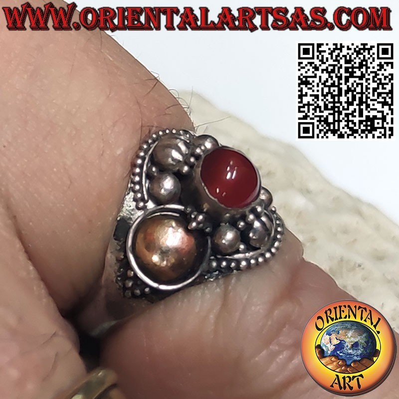 Silver ring with round carnelian and 14 carat gold foil on the sides