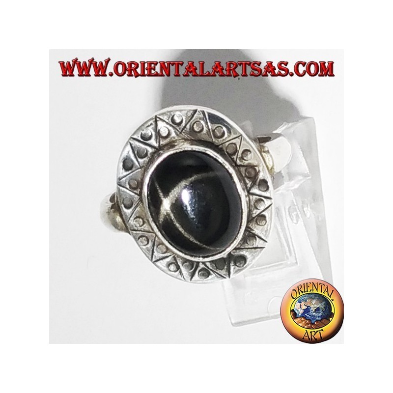 Silver ring with black star with chiselled edge