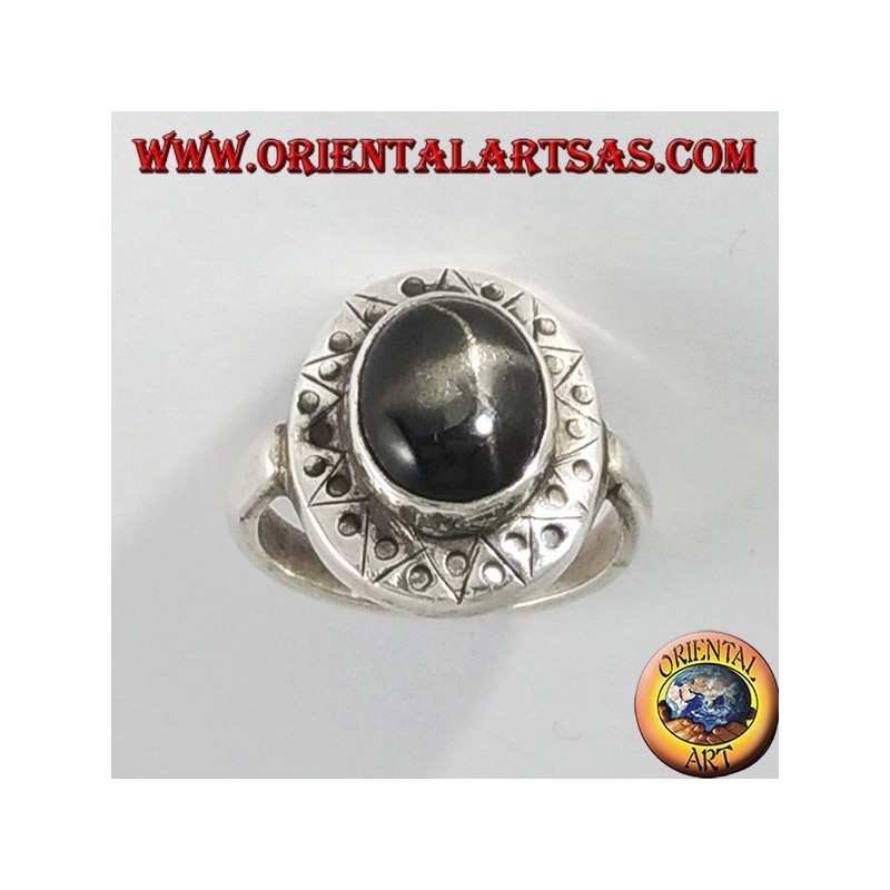 Silver ring with black star with chiselled edge