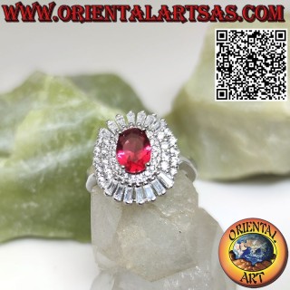 Silver ring with oval ruby surrounded by trapezoid and round zircons