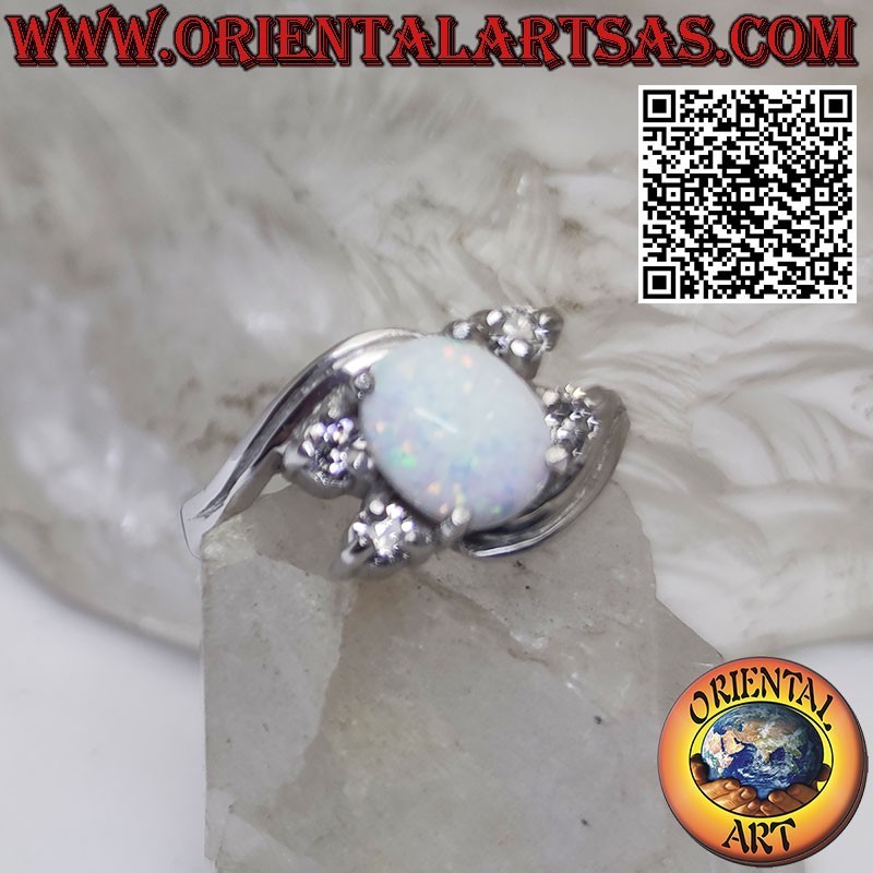 Silver ring with oval harlequin opal set and asymmetric zircons