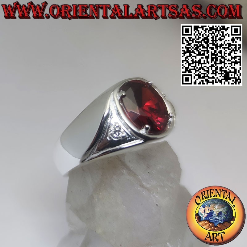 Silver ring with oval garnet set and asymmetric zircons