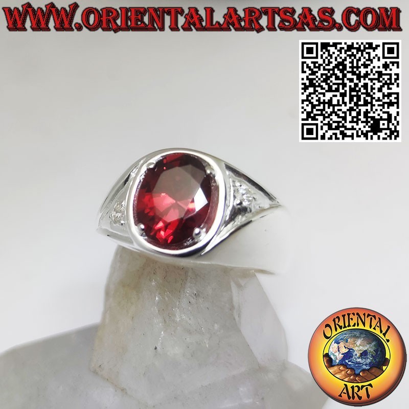Silver ring with oval garnet set and asymmetric zircons