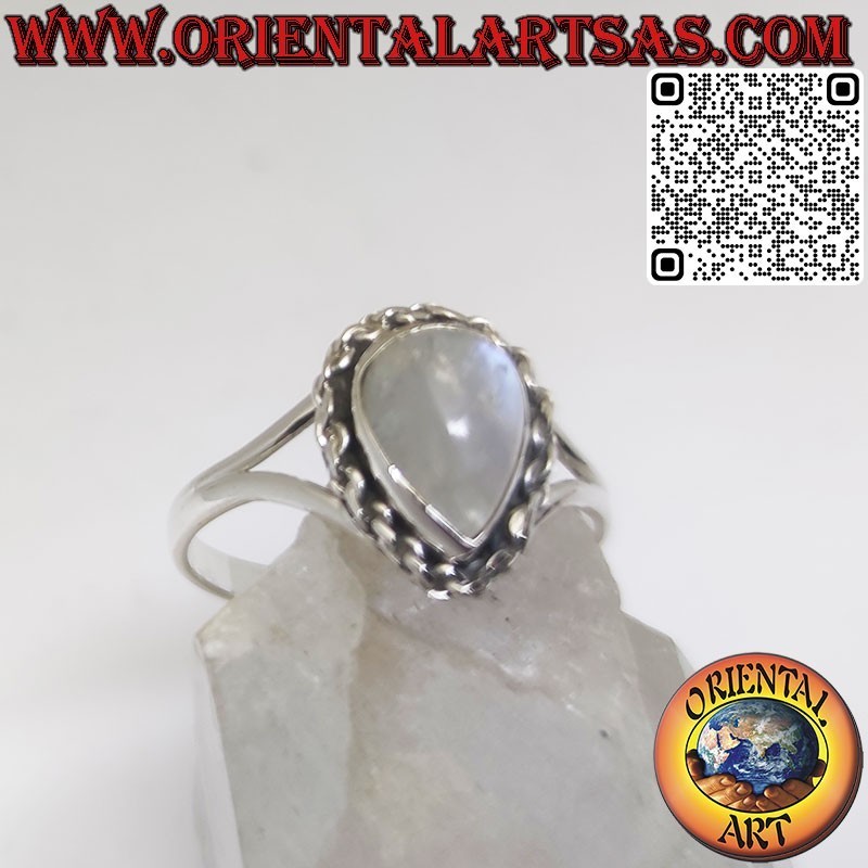 Silver ring with ornate round moonstone and spiral on the sides