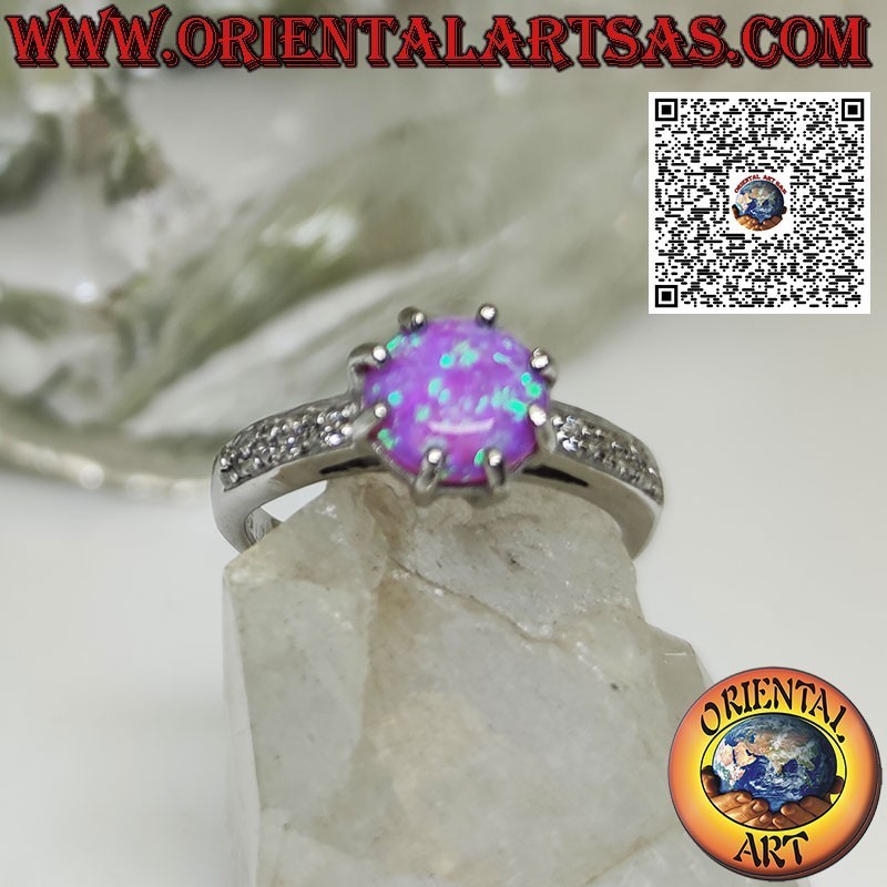 Bague en argent avec sertie ronde d'opales roses et bande de zircons sur les côtés